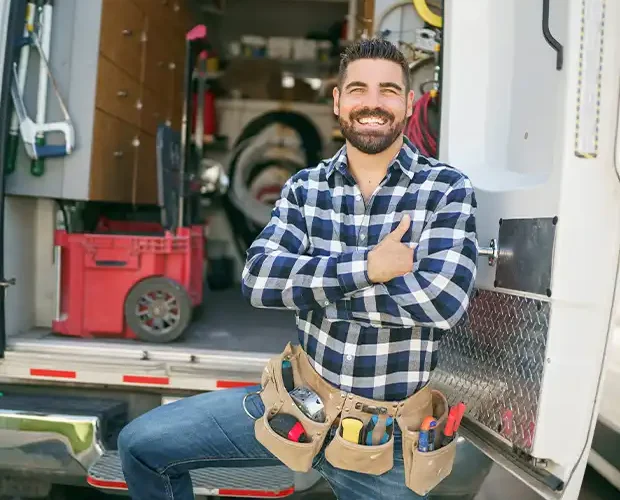 an image of a general contractor, with a tool belt and a checked shirt